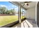 Covered patio with fan overlooking backyard at 965 Talon Pl, Winter Springs, FL 32708