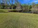 Scenic pond with lush green surroundings, offering a tranquil natural view at 965 Talon Pl, Winter Springs, FL 32708