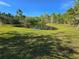 Picturesque pond with surrounding trees and blue skies creating a peaceful environment at 965 Talon Pl, Winter Springs, FL 32708