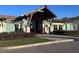 Community clubhouse featuring craftsman-style architecture and verdant landscaping, offering residents a welcoming gathering space at 9787 Introduction Way, Orlando, FL 32832