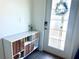 Bright entryway showcasing a modern console table and a decorative glass door at 9787 Introduction Way, Orlando, FL 32832