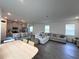 Open concept featuring kitchen, living, and dining spaces at 9787 Introduction Way, Orlando, FL 32832