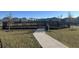 Community playground featuring a swing set and walking path, perfect for outdoor fun and recreation at 9787 Introduction Way, Orlando, FL 32832