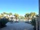 Community pool area with lounge chairs, palm trees, splash pad and inviting recreational spaces at 9787 Introduction Way, Orlando, FL 32832