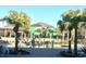 Community splash pad and pool, with palm trees and a pergola, offering a Gathering-friendly environment at 9787 Introduction Way, Orlando, FL 32832