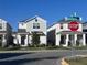 Charming street view featuring well-maintained homes with manicured lawns and clear blue skies at 9787 Introduction Way, Orlando, FL 32832