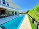 Backyard with pool, outdoor seating and landscaped foliage provides a private oasis for relaxation and enjoyment at 10032 Brocksport Cir, Gotha, FL 34734