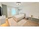 Modern bedroom with a comfortable bed, stylish decor, and plenty of natural light, creating a cozy and inviting space at 10032 Brocksport Cir, Gotha, FL 34734