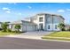 Stunning two-story home boasting a three-car garage and beautiful landscaping at 10032 Brocksport Cir, Gotha, FL 34734