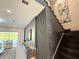 Modern foyer showcasing a staircase with marble accents, complemented by elegant decor and views of the outdoors at 10032 Brocksport Cir, Gotha, FL 34734