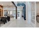 Bright open-concept interior with sleek marble flooring and modern finishes at 10032 Brocksport Cir, Gotha, FL 34734