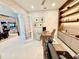 Comfortable home office with built-in shelving, a modern desk, and a view into the living area, ideal for remote work at 10032 Brocksport Cir, Gotha, FL 34734
