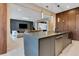 Stylish kitchen featuring a center island and an open view into the living space at 10032 Brocksport Cir, Gotha, FL 34734
