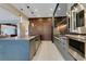 Modern kitchen featuring custom cabinets, stainless steel appliances, and center island with sink at 10032 Brocksport Cir, Gotha, FL 34734