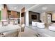 Open-concept kitchen and living room with modern design elements and a seamless flow at 10032 Brocksport Cir, Gotha, FL 34734