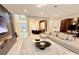 Bright and spacious living room showcasing an open layout, modern furnishings, and elegant design details at 10032 Brocksport Cir, Gotha, FL 34734