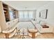 Bright living room featuring a neutral color palette, built-in shelving and cabinetry at 10032 Brocksport Cir, Gotha, FL 34734