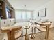 Bright living room featuring a modern entertainment center and light, airy decor at 10032 Brocksport Cir, Gotha, FL 34734
