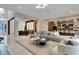 Open-concept living room showcasing modern furniture, decor, and hardwood floors at 10032 Brocksport Cir, Gotha, FL 34734