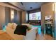 Inviting theater room with a large screen, comfortable seating, and custom lighting at 10032 Brocksport Cir, Gotha, FL 34734