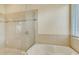 The bathroom has a glass enclosed shower and soaking tub at 1187 Tadsworth Ter, Lake Mary, FL 32746