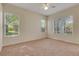 Bedroom with neutral paint, carpet and lots of windows at 1187 Tadsworth Ter, Lake Mary, FL 32746