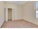 Well-lit bedroom featuring carpet, closet, and a large window at 1187 Tadsworth Ter, Lake Mary, FL 32746