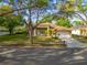 Charming single-story home with a well-maintained front yard, mature trees, and a two-car garage at 1187 Tadsworth Ter, Lake Mary, FL 32746