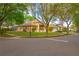 Corner view of the home showing the side and front exterior, screened in patio, and manicured lawn at 1187 Tadsworth Ter, Lake Mary, FL 32746