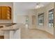 Bright breakfast nook adjacent to the kitchen with views of the backyard and pool at 1187 Tadsworth Ter, Lake Mary, FL 32746