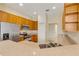 Bright kitchen with stainless steel appliances, light cabinets, and stone countertops at 1187 Tadsworth Ter, Lake Mary, FL 32746