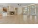 Bright living room boasts a fireplace, neutral paint, and large windows at 1187 Tadsworth Ter, Lake Mary, FL 32746
