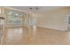 Open living room featuring tile floors, large windows, and neutral paint at 1187 Tadsworth Ter, Lake Mary, FL 32746