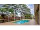 A private pool surrounded by a screened enclosure with plenty of surrounding yard at 1187 Tadsworth Ter, Lake Mary, FL 32746