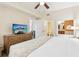 Bright bedroom with a large bed, TV, and an en-suite bathroom at 12527 Floridays Resort Dr # E-111, Orlando, FL 32821