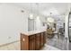 Bright kitchen and dining area featuring an island with granite countertops and a dining table at 12527 Floridays Resort Dr # E-111, Orlando, FL 32821