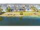 Waterfront homes with backyard pools and lush landscaping line a scenic walking path at 13059 Stoddart Ave, Orlando, FL 32827