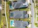 Aerial shot showcases backyard pools and the neighborhood's proximity to green space at 13059 Stoddart Ave, Orlando, FL 32827