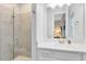 Bright bathroom featuring a glass enclosed shower and white vanity at 13059 Stoddart Ave, Orlando, FL 32827