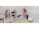 Walk-in closet with metal shelving for organizing shoes, clothes, and storage items at 13059 Stoddart Ave, Orlando, FL 32827