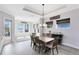 Dining room with views to the lake offers a spacious setting for meals and entertaining guests at 13059 Stoddart Ave, Orlando, FL 32827