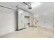Attached garage with storage cabinets and a workspace area at 13059 Stoddart Ave, Orlando, FL 32827