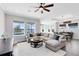 Open living room with water views, comfortable seating, and modern furnishings at 13059 Stoddart Ave, Orlando, FL 32827