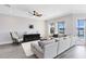 Stylish living area with water views, modern furniture, and hardwood floors at 13059 Stoddart Ave, Orlando, FL 32827