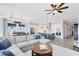 Bright open floor plan with modern kitchen and spacious living area at 13059 Stoddart Ave, Orlando, FL 32827