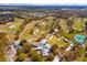 Aerial view of a golf course community with mature trees and pristine landscaping at 1322 Ensenada Dr, Orlando, FL 32825