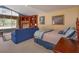 Comfortable main bedroom with large windows and built-in display cabinet for storage at 1322 Ensenada Dr, Orlando, FL 32825