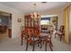 Bright dining room featuring a chandelier and view into the formal living area with lots of natural light at 1322 Ensenada Dr, Orlando, FL 32825
