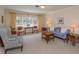 Traditional living room with large windows providing abundant natural light, carpet floors and neutral walls at 1322 Ensenada Dr, Orlando, FL 32825