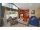 A charming living area featuring a cozy armchair, built-in bookshelves, and a large window at 1322 Ensenada Dr, Orlando, FL 32825